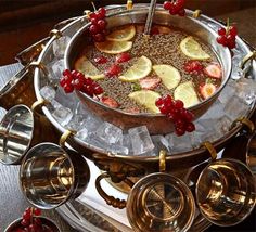 a silver platter filled with food on top of a table