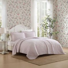 The Laura Ashley marta stripe quilt set is a combination of timeless style that complements a wide variety of bedroom dcors, particularly in a country or cottage style. Pink and green floral stripes, bring fresh and light aesthetic to the room with a classic, elegant pattern. Made from 100% cotton, this quilt offers a soft and breathable feel, perfect for comfort and warmth. The set includes both the quilt and matching shams, which help to complete the look. Pre-washed for extra softness and filled with a blend of 80% cotton 20% polyester for warmth and durability. Twin quilt 2 pc. Set includes 1 quilt and 1 standard sham; full/queen quilt 3 pc. Set includes 1 quilt and 2 standard shams; king quilt 3pc. Set includes 1 quilt and 2 king shams. Twin set: quilt 88l x 68w, standard sham 21"l x Pink Cottagecore Room, Pink Quilt Set, Pink Cottagecore, Cottagecore Room, Pink Quilt, Cotton Quilt Set, Light Aesthetic, Striped Quilt, Lightweight Quilt