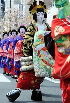 some people in costumes are walking down the street