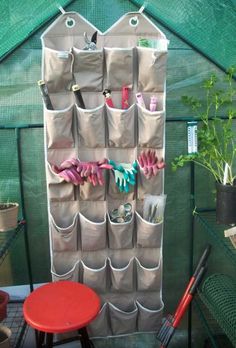 a green house with several pockets on the wall