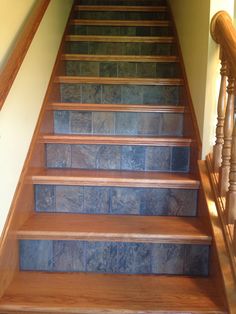 a set of wooden stairs leading up to a second floor