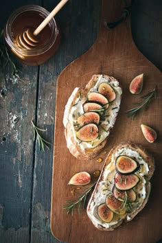 an image of bread with figs on it and yogurt in the background