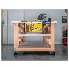 a table sawing on top of a workbench in a room with tools