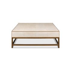 the coffee table is made out of wood and has a beige fabric covering on top