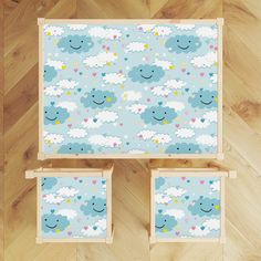 two wooden frames with clouds and hearts on them, against a wood flooring background