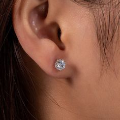 Elevate any outfit with the timeless elegance of Classic 1.0ct Moissanite Stud Earrings in White Gold by Evani Naomi Jewelry. Handcrafted from 92.5% pure silver and 7.5% hypoallergenic metals, these studs are dipped five times in 18k white gold to create a dazzling finish. The simple yet stunning six-prong design ensures the highest-quality sparkle, perfect for any occasion. With superior craftsmanship and affordable pricing, these earrings are a must-have addition to any fine jewelry collection Classic Hypoallergenic Diamond Earrings, Classic Hypoallergenic Diamond White Diamond Earrings, Hypoallergenic Classic Round Diamond Earrings, Silver Solitaire Earrings With Lab Grown Diamonds, Classic Silver Moissanite Earrings, Hypoallergenic Diamond White Round Cut Earrings, Simple Diamond Earrings, Diamond Carat Size, Cvd Diamond