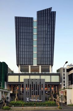 the exterior of a modern hotel with large windows