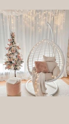 a living room with a christmas tree in the corner and a chair next to it