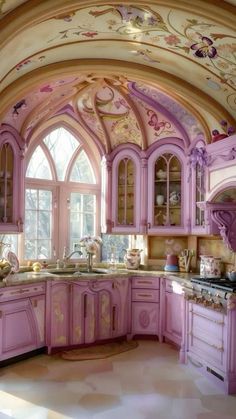 a kitchen with pink cabinets and an arched ceiling