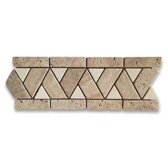 a beige and white tile border with an arrow design on it's side,