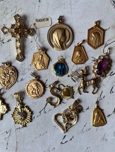 Lovely French Antique 18k Religious Goldplated Charms  24k color stainless steel pendants handmade vintage necklace Choose your charms from this beautiful set of 25 charms , The numbers are on the photo, select the nr charm(s) from the drop-down menu , Each charm comes with an adjustable 22" metal steel chain in matching color. (see behind each number in menu what material and period. Worldwide shipping within two weeks Handmade Dainty Pendant Charms, Dainty Handmade Pendant Charms, Antique Charm Necklaces For Collectors, Bronze Pendant Necklace With Charms, Heirloom Rose Gold Jewelry With Charms, Personalized Vintage Gold-plated Jewelry, Personalized Vintage Gold Plated Jewelry, Vintage Collection Round Pendant Necklaces With Charms, Vintage Charm Pendant Necklace For Gift