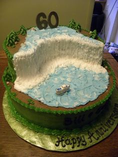 a birthday cake with a boat in the water