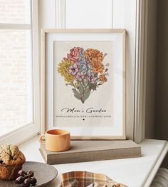 a table topped with plates and cups filled with food next to a framed print that says mom's garden