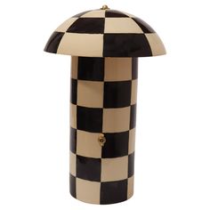 a black and white checkered lamp on a white background