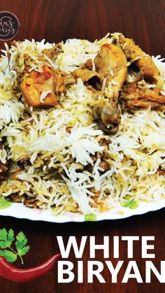 white biryani with meat and vegetables on a plate