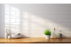 there is a potted plant on the counter in front of a white brick wall