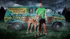 a woman standing in front of a van covered in graffiti