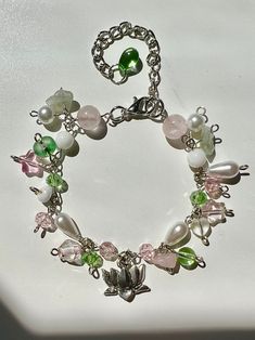 a close up of a bracelet with charms