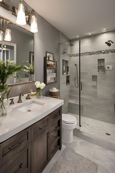 a bathroom with two sinks, a toilet and a walk - in shower next to it