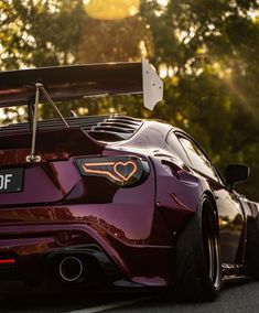 the back end of a purple sports car