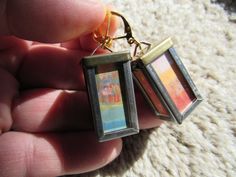 "Very unusual glass and brass box earrings!!  Two sets available with messages on the bottom and images inside the glass.  Measures 1\" tall x 0.5\" wide.  Lightweight." Spiritual Brass Jewelry With Rectangular Pendant, Antique Rectangular Brass Jewelry, Turquoise Soldered Brass Earrings, Modern Rectangular Glass Jewelry, Unique Rectangular Glass Jewelry, Jewelry Earrings Dangle, Etsy Earrings, Dangle Drop Earrings, Dangle Earrings