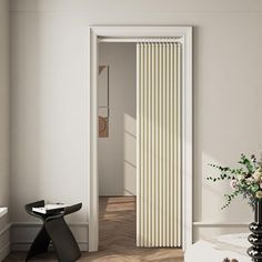 an open door leading into a white room