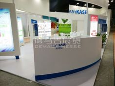 an exhibition stand with white and blue accents