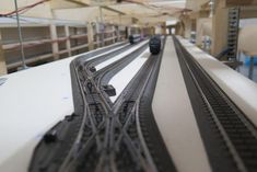 a toy train on the tracks in a building