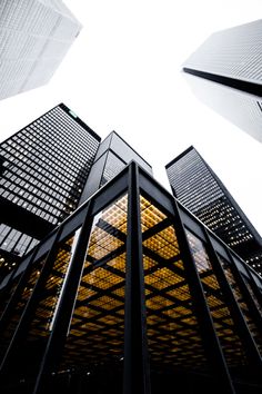 looking up at skyscrapers from the ground to the sky, in an urban area