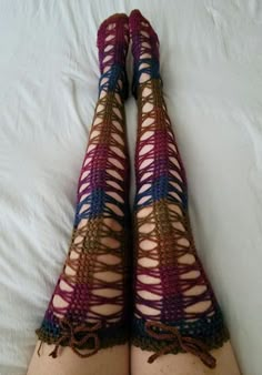 a woman's legs with crocheted stockings on