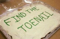 a cake with green frosting that says find the toenail