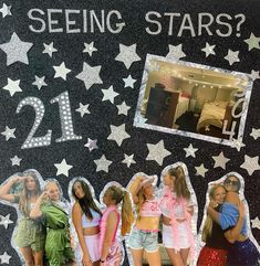 some girls are standing in front of a wall with stars and the number 21 on it