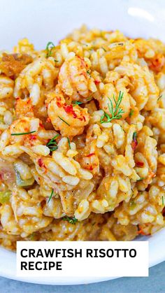 a white bowl filled with pasta and shrimp