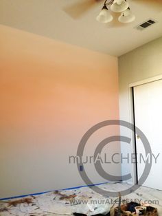 an empty room is being painted with orange and pink colors in preparation for the next painting job