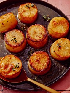 some food is cooking in a pan on the table