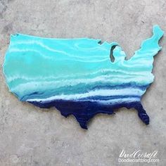 the united states painted in shades of blue and green with waves on it's side