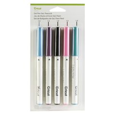 four pens with different colors on them in the packaging for each pen, one is white and