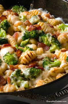 a casserole dish with broccoli, bacon and cheese