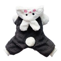 a small stuffed animal wearing a black and white outfit with pink eyes on it's chest