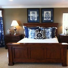 a large bed sitting in a bedroom next to two lamps