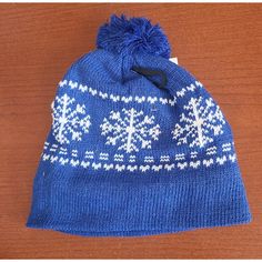 Stay Warm And Stylish On The Slopes With This Winter Ski Hat From Juncture. Featuring A Blue And White Snowflake Pattern, This Beanie Is Perfect For Casual Skiing And Other Winter Activities. The One Size Fits All Hat Is Unisex And Features A Pom On Top. Lined For Added Warmth, It's Perfect For Staying Cozy During The Chilly Winter Months. Whether You're A Seasoned Skier Or Just Starting Out, This Beanie Is A Great Addition To Your Winter Sports Gear. Warm Blue Beanie For Winter, Blue Winter Beanie Cap, Blue Beanie For Winter, Warm Blue Beanie Cap, Blue Beanie Hat For Winter, Blue Winter Hats For Cold Weather, Blue Warm Beanie For Cold Weather, Warm Blue Hats For Winter, Warm Blue Beanie Hat