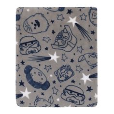 a blue and white blanket with various cartoon characters on it, all over the surface