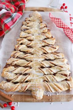 a christmas tree shaped pastry sitting on top of a cutting board