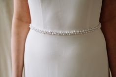 Expertly crafted to cinch your waist perfectly, the Stevie Sash is a must-have for the minimalist bride. Made with ivory pearls and satin ribbon, this thin pearl bridal sash adds a modern and unique touch to any wedding dress. Flattering and elegant, it's the perfect accessory for your special day. DIMENSIONS: Pearl beaded section is available in 18", 24" and 30" lengths. Width of the sash is 1/2" and total length of the sash including pearl beaded section and ribbon is six feet. Each order is t Vine Jewelry, Bridesmaid Belt, Pearl Belt, Minimalist Bride, Wedding Belt, Wedding Sash Belt, Wedding Sash, Bridal Sash, Pearl Bridal