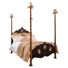 a bed with two palm trees on the headboard and foot board in front of it