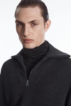 This modern jumper is expertly knitted from a blend of RWS wool and cotton that's weighty and warm. Offered in versatile black, it's shaped for a relaxed fit and designed with a foldover half-zip collar, which can be worn fastened up or slightly open to show your T-shirt underneath.  Relaxed fitSlightly dropped shouldersCertified according to the Responsible Wool Standard, to protect the welfare of the sheep and their environment 65% RWS Wool, 35% Cotton / Machine wash Back length of size M is 6 Merino Wool Funnel Neck Polo Sweater, Modern Sweater With Ribbed Collar For Winter, Modern Winter Sweater With Ribbed Collar, Gray Half-zip Sweater For Fall, Gray Half-zip Fall Sweater, Wool Half-zip Sweater With Ribbed Collar, Wool Half-zip Sweater With Ribbed Cuffs, Modern Sweater With Funnel Neck, Half-zip Polo Sweater With Ribbed Cuffs For Winter