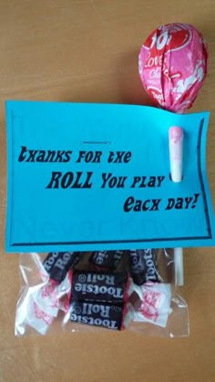 candy bar wrapper and lollipops on table