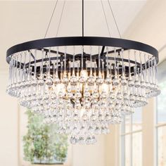 a chandelier hanging from the ceiling in a dining room