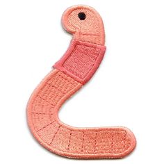 the letter s is made out of woven material and has a pink ribbon around it