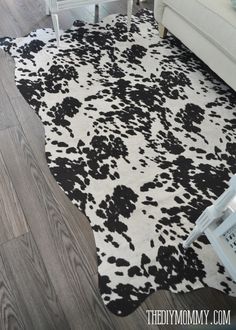 black and white cow print rug in living room